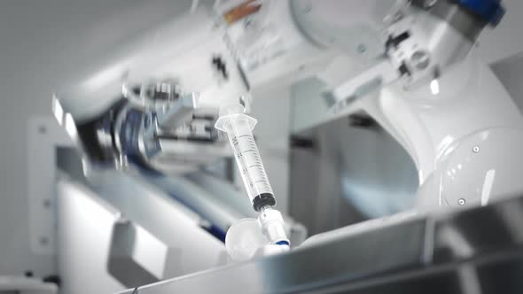 The Innovative Arms of a Robotic Arm Make an Injection of Chemotherapy for a Cancer Patient