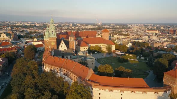 Aerial Drone View of Royal Wawel Cathedral and Castle at Sunset in Krakow, Poland. Vistula River