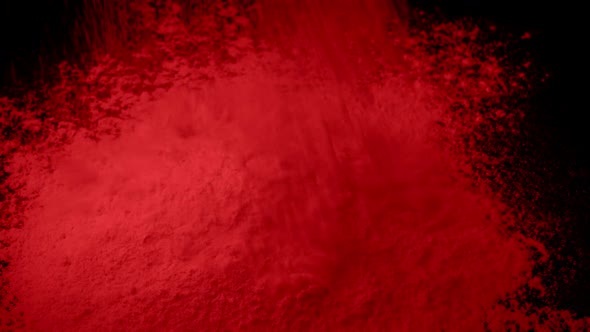 Red Powder Is Poured Into Pile
