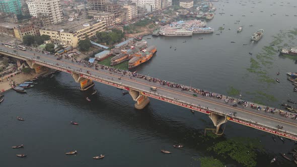 Aerial Over The Old Dhaka City with bridge and river port In Bangladesh. Parallax View