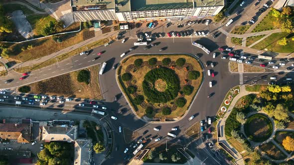 Aerial drone view of Chisinau at sunset. Vertical, hypelapse view of a roundabout intersection