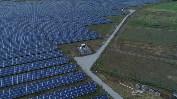 High Angle Footage of a Solar Power Station in the Field with a Transformer