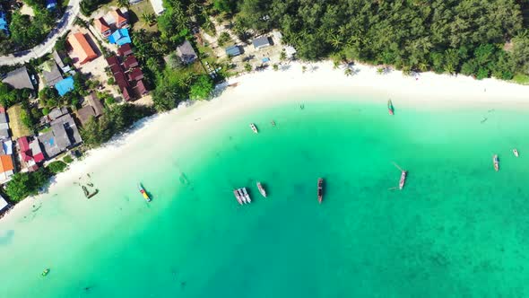 Aerial drone shot tourism of marine sea view beach voyage by blue ocean and white sandy background o