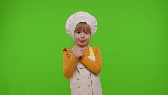 Kid Girl Dressed As Cook Chef Baker in Apron Dancing Fooling Around Showing Tongue Chroma Key
