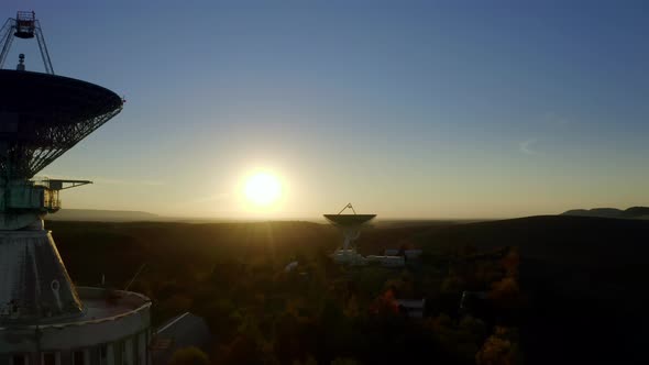 Aerial Drone View of Telecommunications Antenna or Radio Telescope Satellite Dish on Sunset