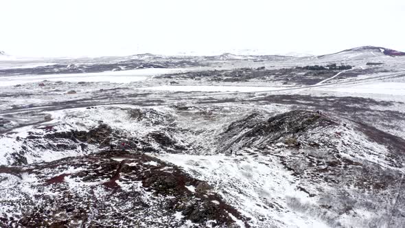 Tourists Looking in to the Snowy Kerid Crater in Iceland Seen From the Air