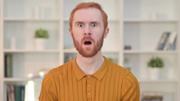Portrait of Shocked Young Man Reacting to Failure