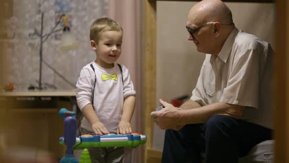 Grandfather and childred playing