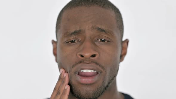 Face Close Up of Young African Man with Toothache