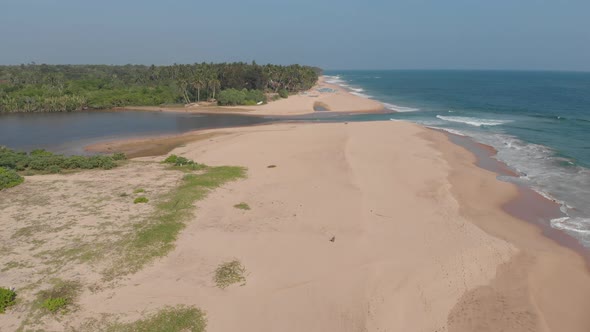 Kahanda Modara beach by drone in Sri Lanka. Along the endless beach.