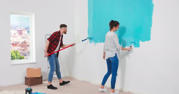 Close Up Portrait of Happy Young Mixedraces Family Couple Together in New Apartment Renovating Room