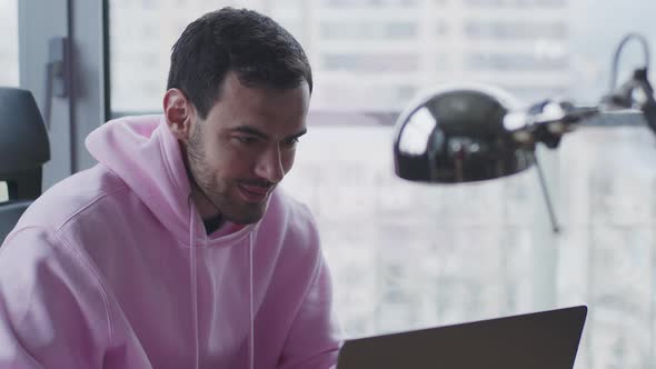 A Young Handsome Man Works in the Office