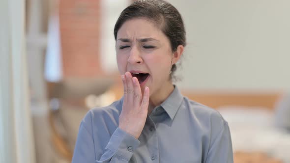 Portrait of Young Indian Woman Yawning