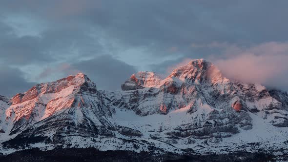 Sunrise Time Lapse rocky mountains after a heavy snowfall