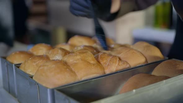 Bakery, Chef, Condit Woman in Gloves Lubricates Hot Fragrant Buns Taken Out of Oven with Silicone