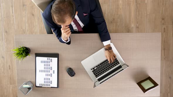 Top View of Businessman at His Desk