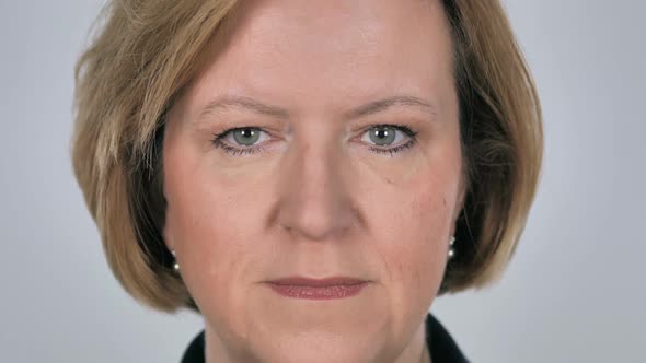 Close Up of Serious Old Woman Face White Background