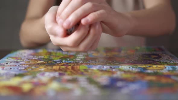 Child Hands on Board Game