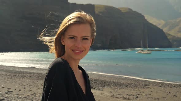 Model’s Hair Being Blown by the Wind Along the Beach on a Windy Summer