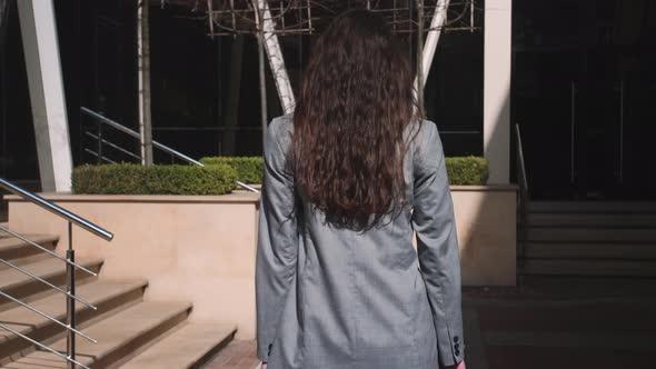 Beautiful Woman Walking in the Street