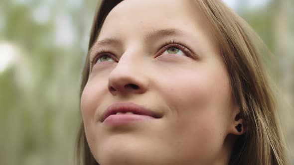 Portrait of Happy Young Caucasian Woman, Tourists Enjoying Fresh Air and Sun Rays in the Park.