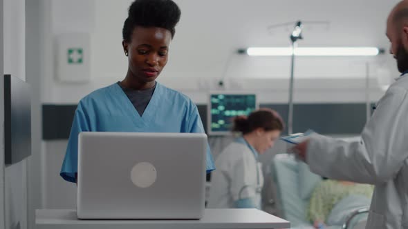 Afro American Assistant Typing Sickness Symptom on Computer