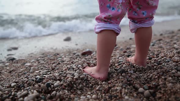 Child is at the Edge of the Sea Barefoot