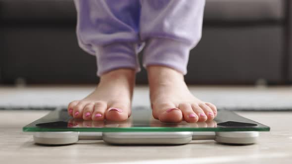 Fitness Diet Woman Feet Standing Weighing Scales on Room