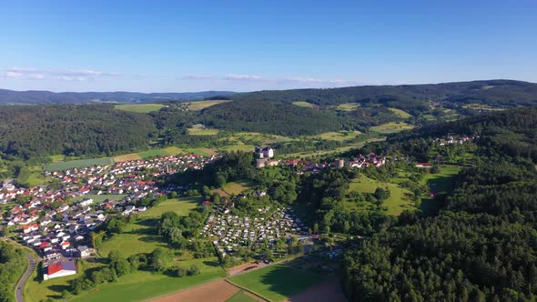 Drone video of the village Lichtenberg with castle in Germany during daytime