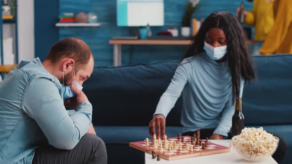 Mixed Races of Friends Moving Pieces on the Chessboard