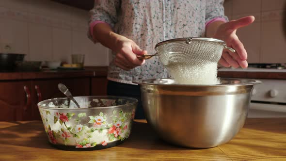 Sifting flour through sieve