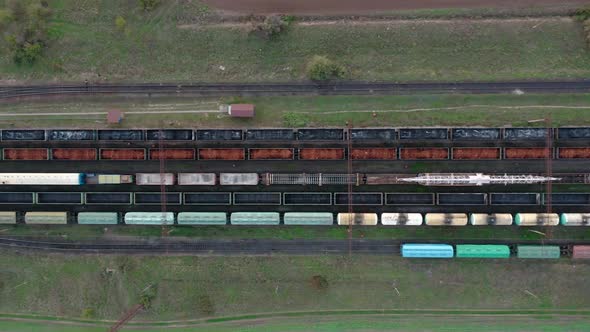 An Aerial Drone View of a Locomotive Pulling Railway Carriages