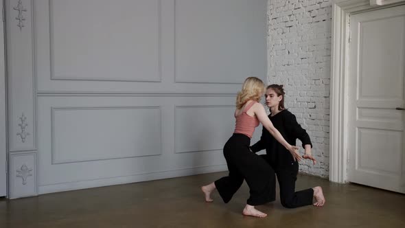 Dancers are Rehearsing Modern Dance in Hall Young Man and Woman are Dancing