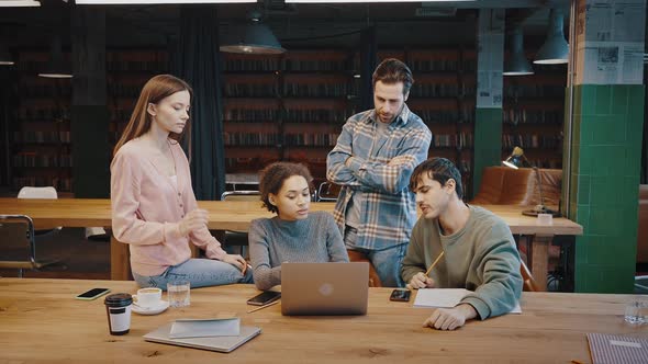 Young Black Lady Team Leader Gather Subordinates Before Laptop Screen