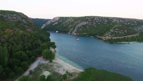 A ferry boat traversing the water of Skradin in Šibenik-Knin County Croatia