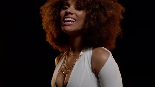 Pretty Smiling African American Woman with Afro Style Hair Dancing on the Stage