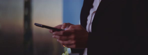 Female hands typing message on mobile