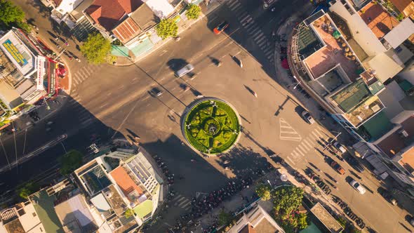 Drone view time lapse of traffic go around the roundabout in Nha Trang city, Vietnam.