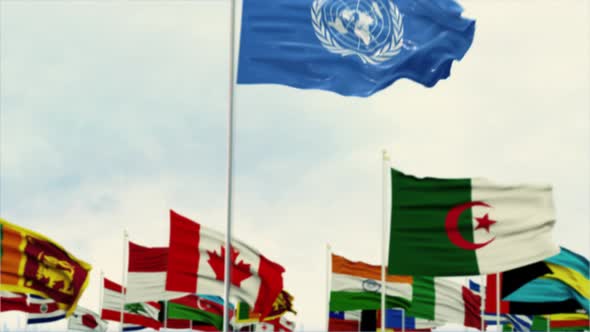 United Nations Flag With World Globe Flags Morning Shot