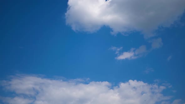 Clouds Move Smoothly in the Blue Sky. Timelapse