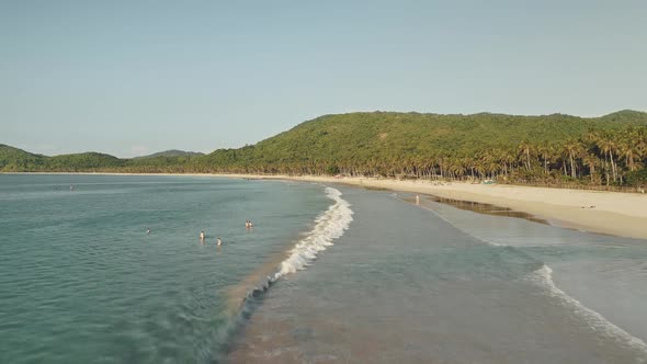 Timelapse of Tourists Rest at Shallow Water of Sea Coast Aerial View