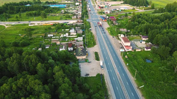 Aerial View of an Asphalt Suburban Intersection with Waiting Cars
