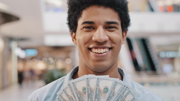 Happy Wealthy Successful Smiling African American Business Man Looking at Camera Holding Fan of