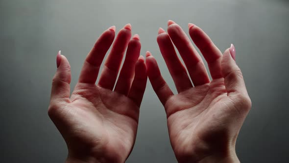 Female Hands on Grey Background Woman Showing Palms and Fingers Closeup Human Skin Texture