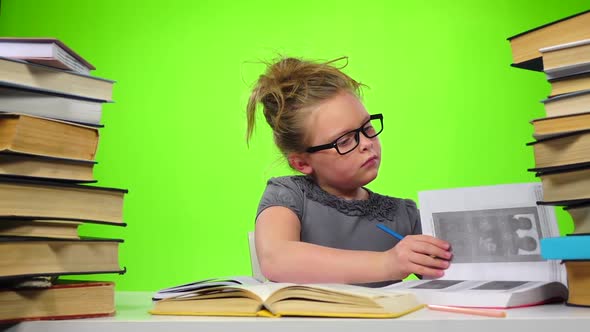 Girl Leafing Through the Pages of Books Carefully. Green Screen. Slow Motion