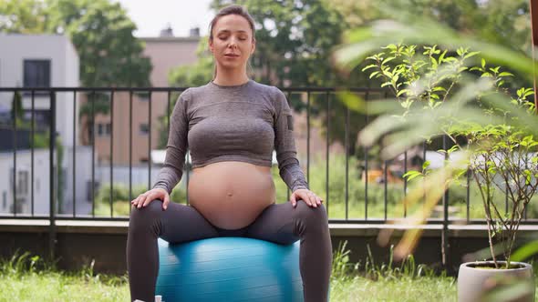 Pregnant woman making breath exercise. Shot with RED helium camera in 8K