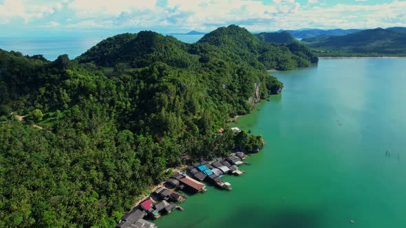 Aerial shot of local fisherman village beside the sea