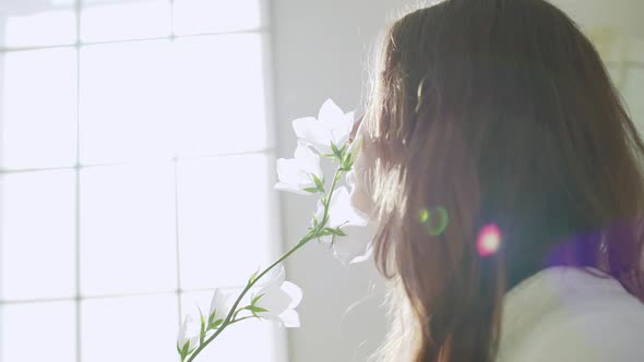 Young Beautiful Girl in White Decor