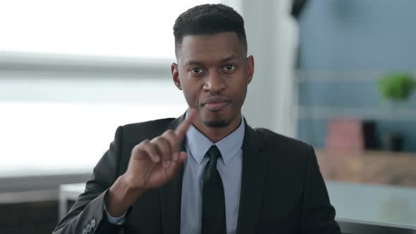 Portrait of African Businessman Showing No Sign by Finger, Denial