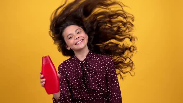 Happy Beautiful Kid Waving Her Long Curly Hair Promoting Shampoo Hair Health